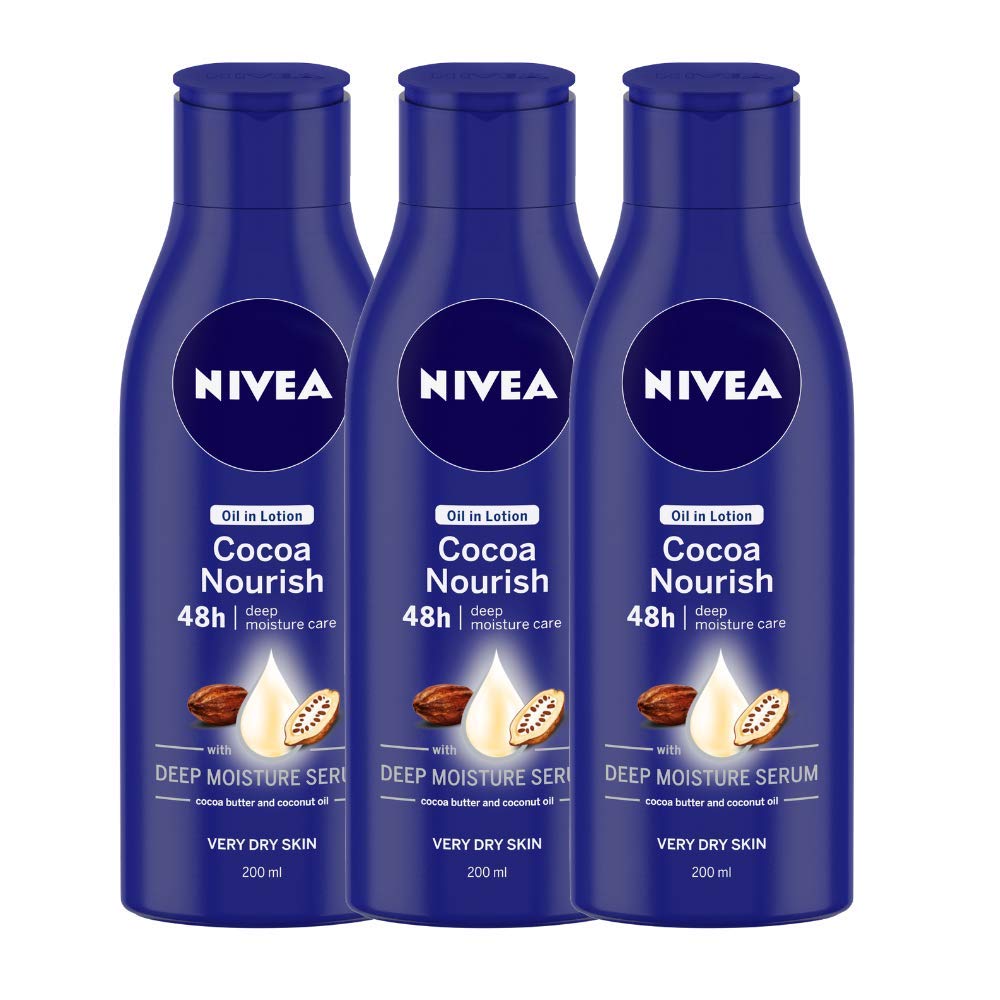 Three Nivea Cocoa Nourish body lotion bottles for dry skin