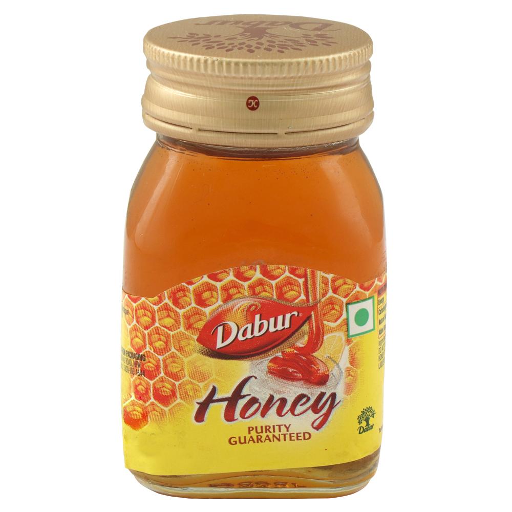 Front view of Dabur Honey 100g pure honey bottle