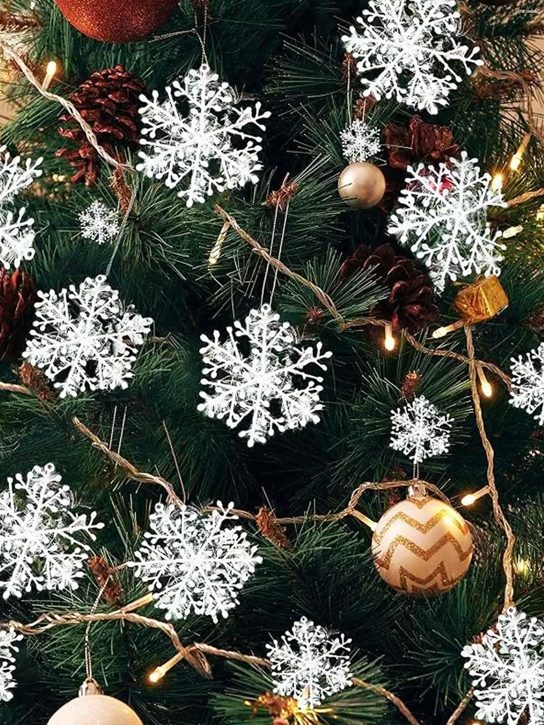 White 5 inch snowflake ornaments arranged for tree decoration