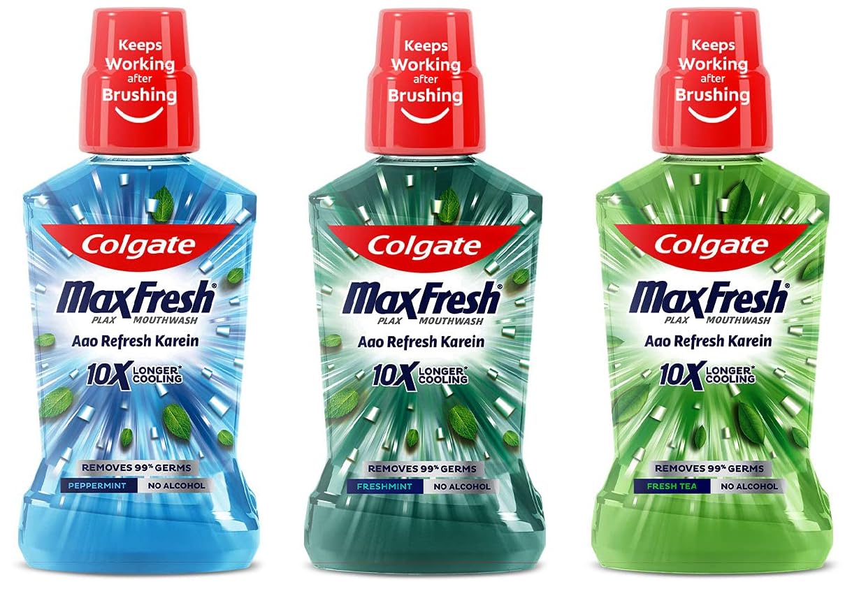 Three Colgate Plax mouthwash bottles in Fresh Mint, Tea, Pepper Mint