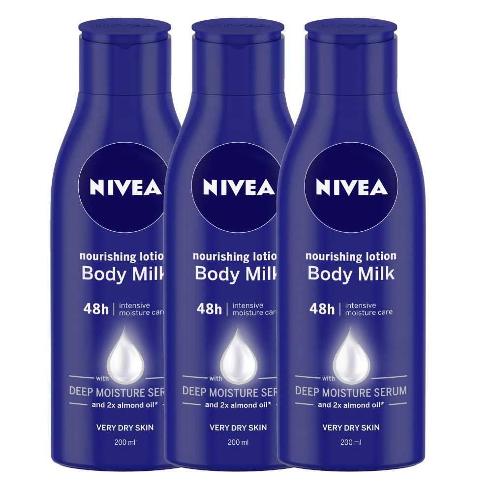 Three bottles of Nivea body milk for dry skin