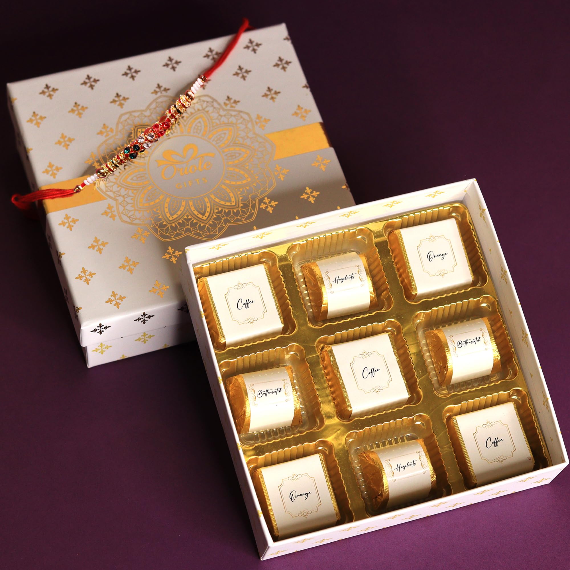 Oriole Gifts Rakhi Gift Hamper with Premium Chocolates for Brother & Sister with 1 Rakhi & 9 Premium Chocolates (Coffee, Hazelnuts, Butterscotch, Orange)