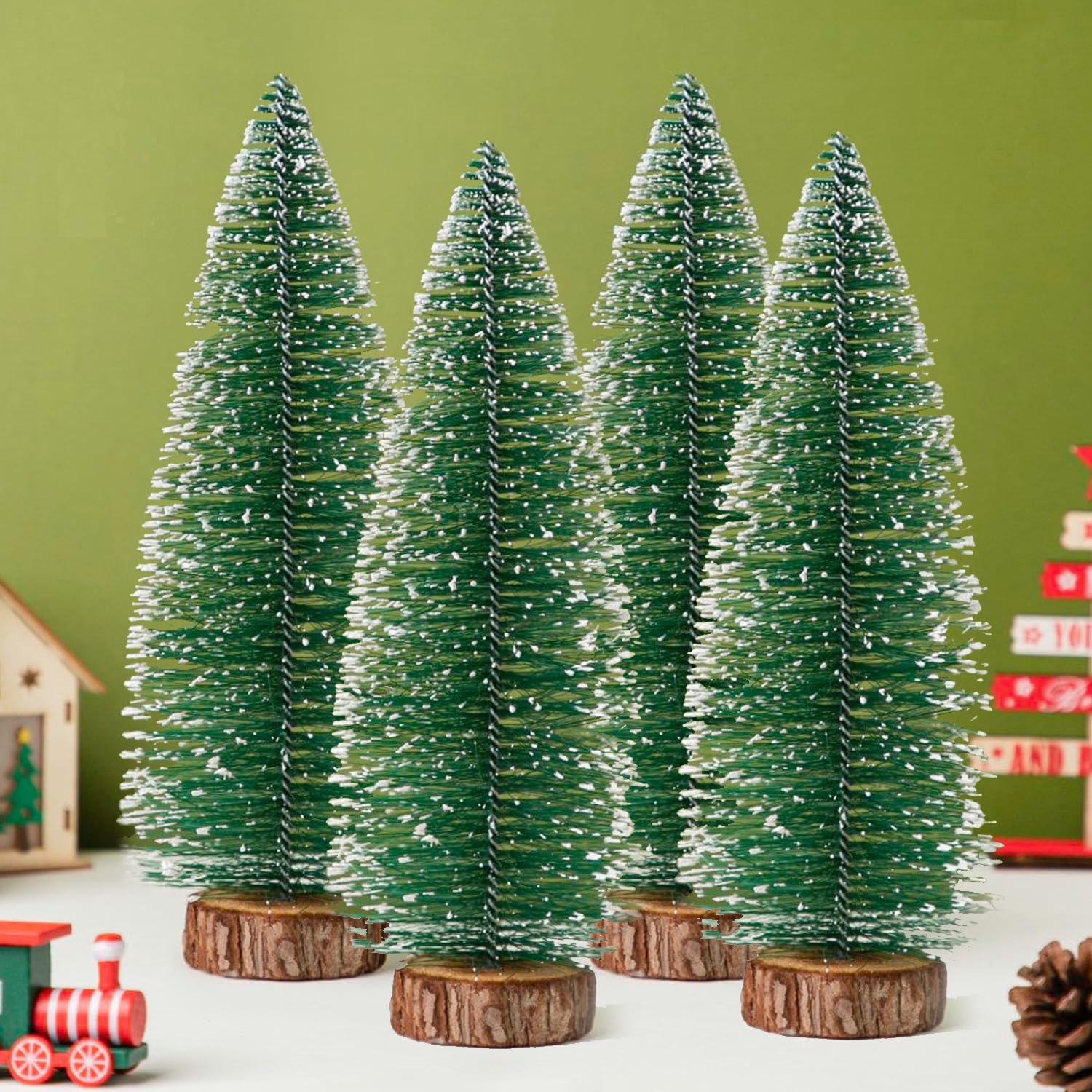Four 15.2 cm artificial mini Christmas trees on wooden bases