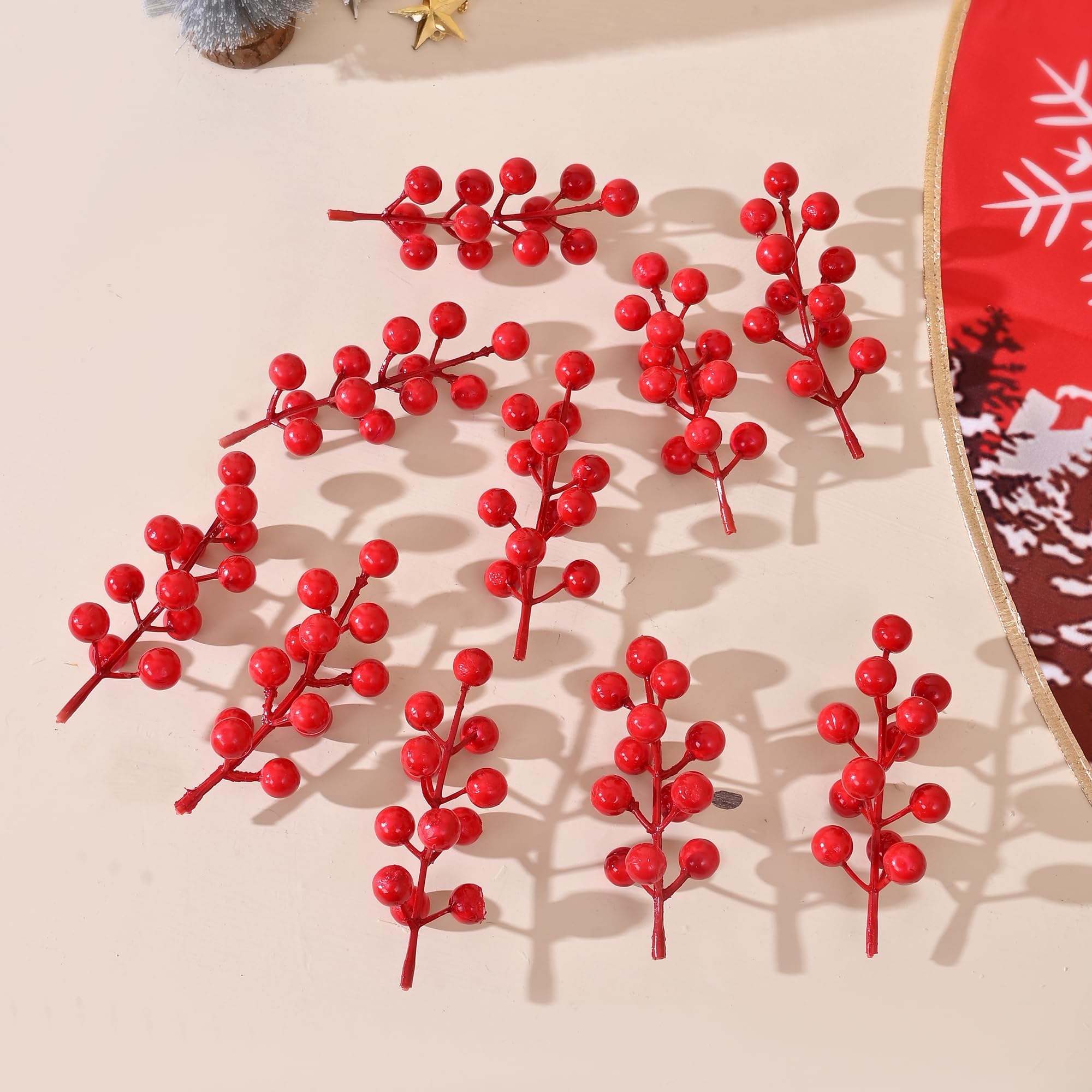 Five red berry ornaments for indoor Christmas decor display