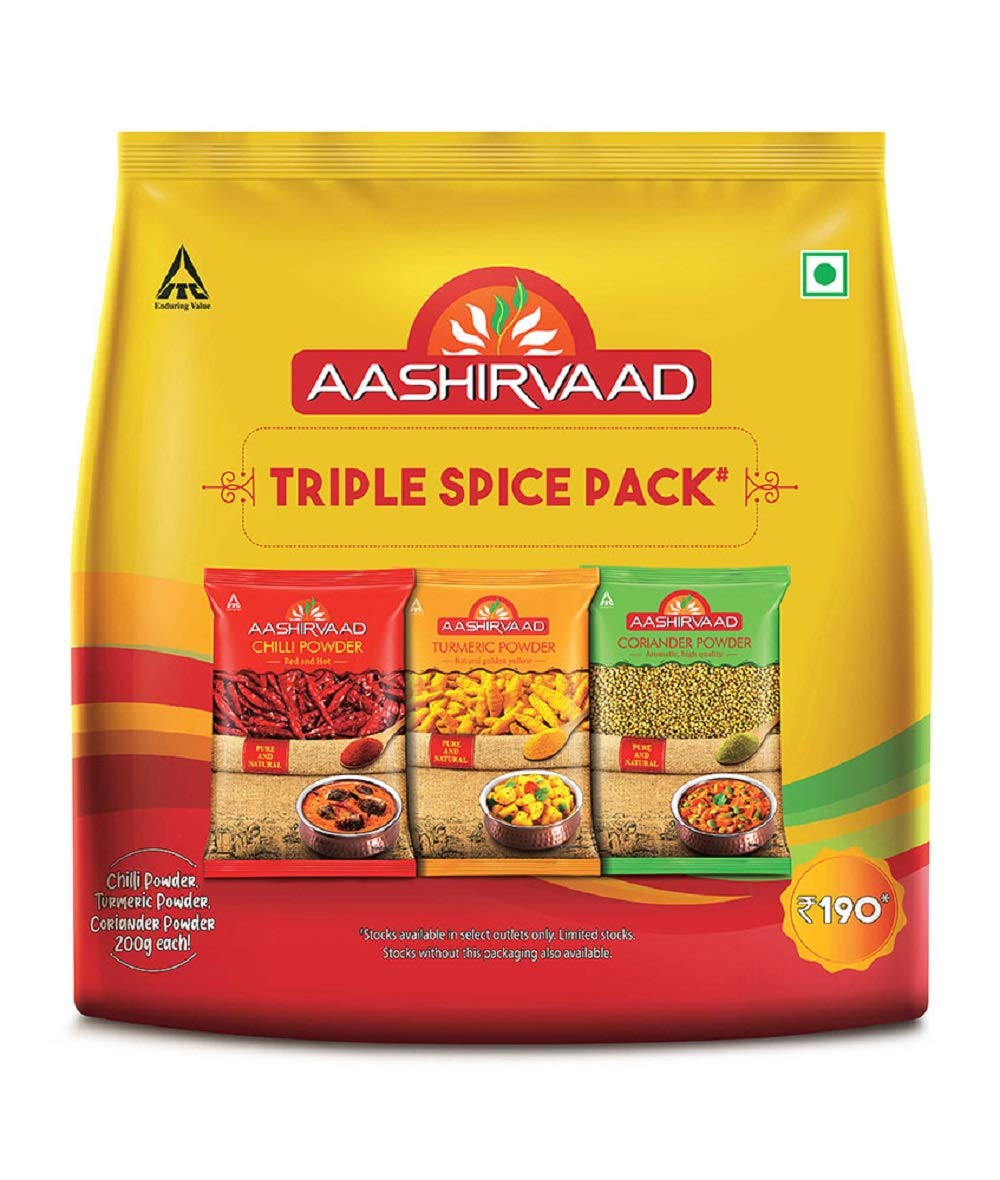 Three Aashirvaad spice powder bags for chilli turmeric and coriander