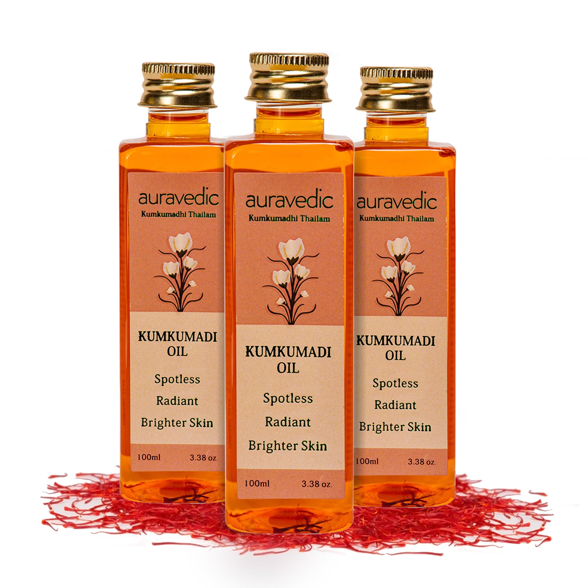 Three bottles of Auravedic Kumkumadi face oil for facial use