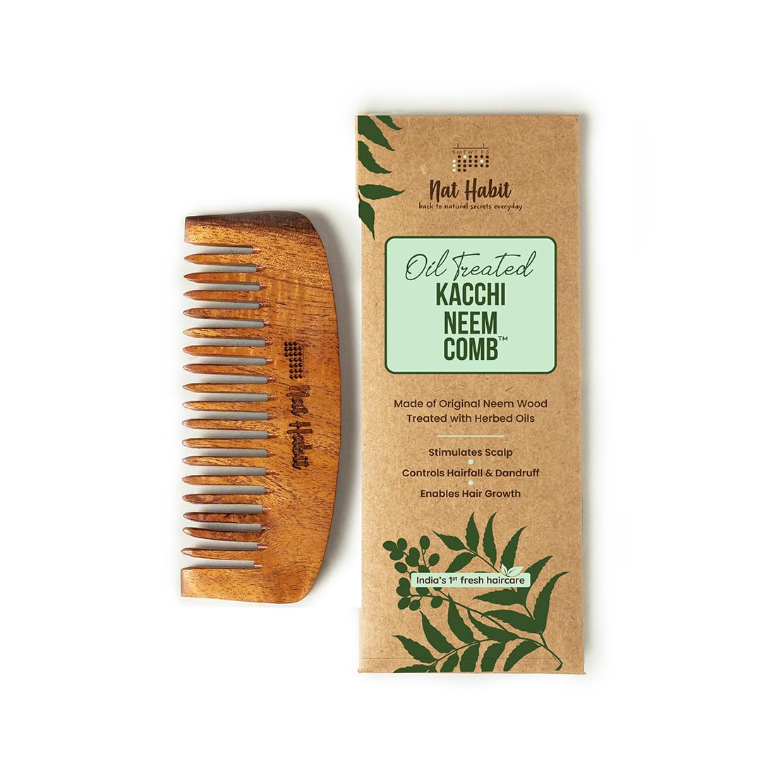 Wide tooth brown neem wood comb soaked in herbs