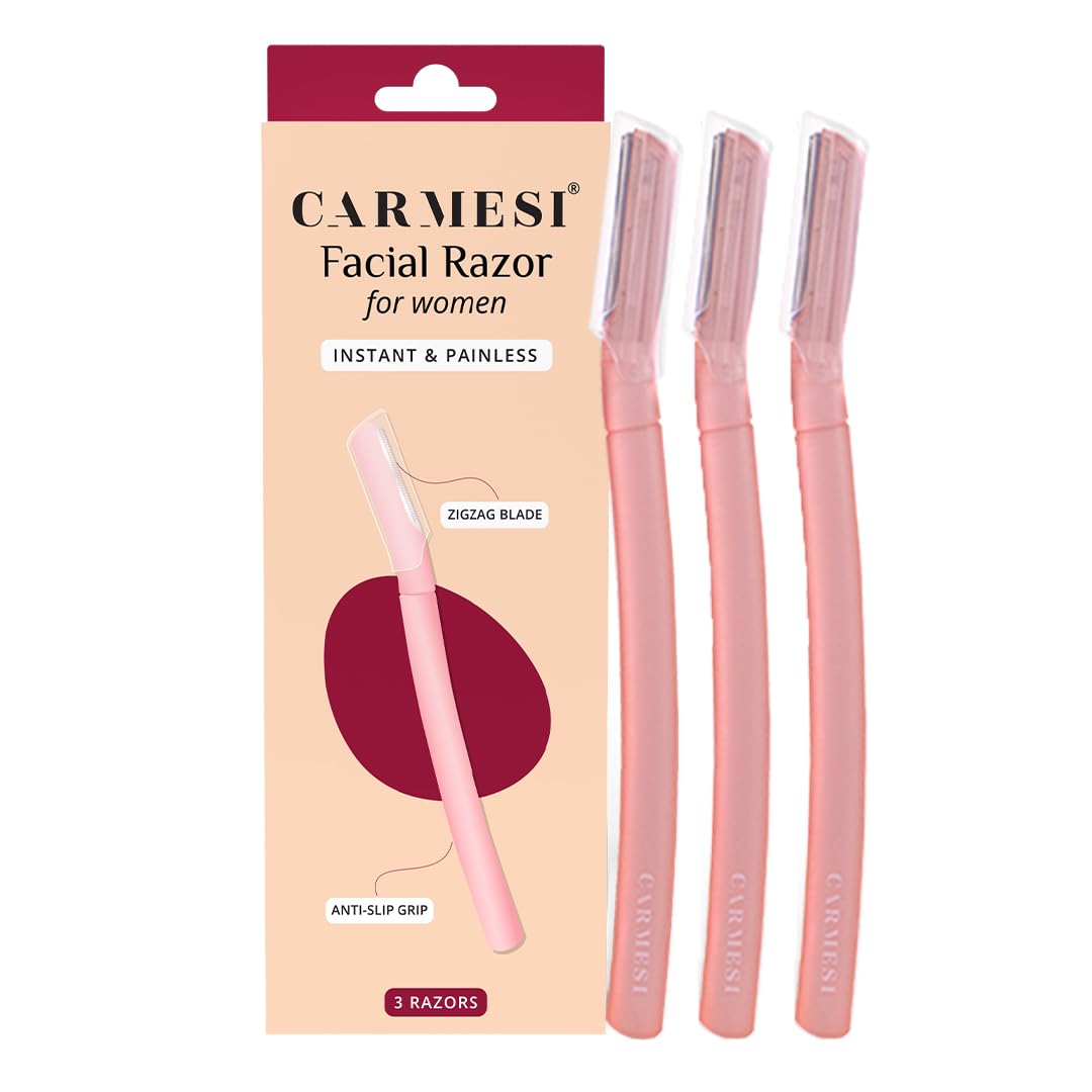 Three pink Carmesi facial razors with protective caps